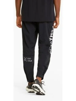 Puma Trainingshose "Train Logo" In Schwarz -Mustiag Geschaft puma trainingshose train logo in schwarz 3